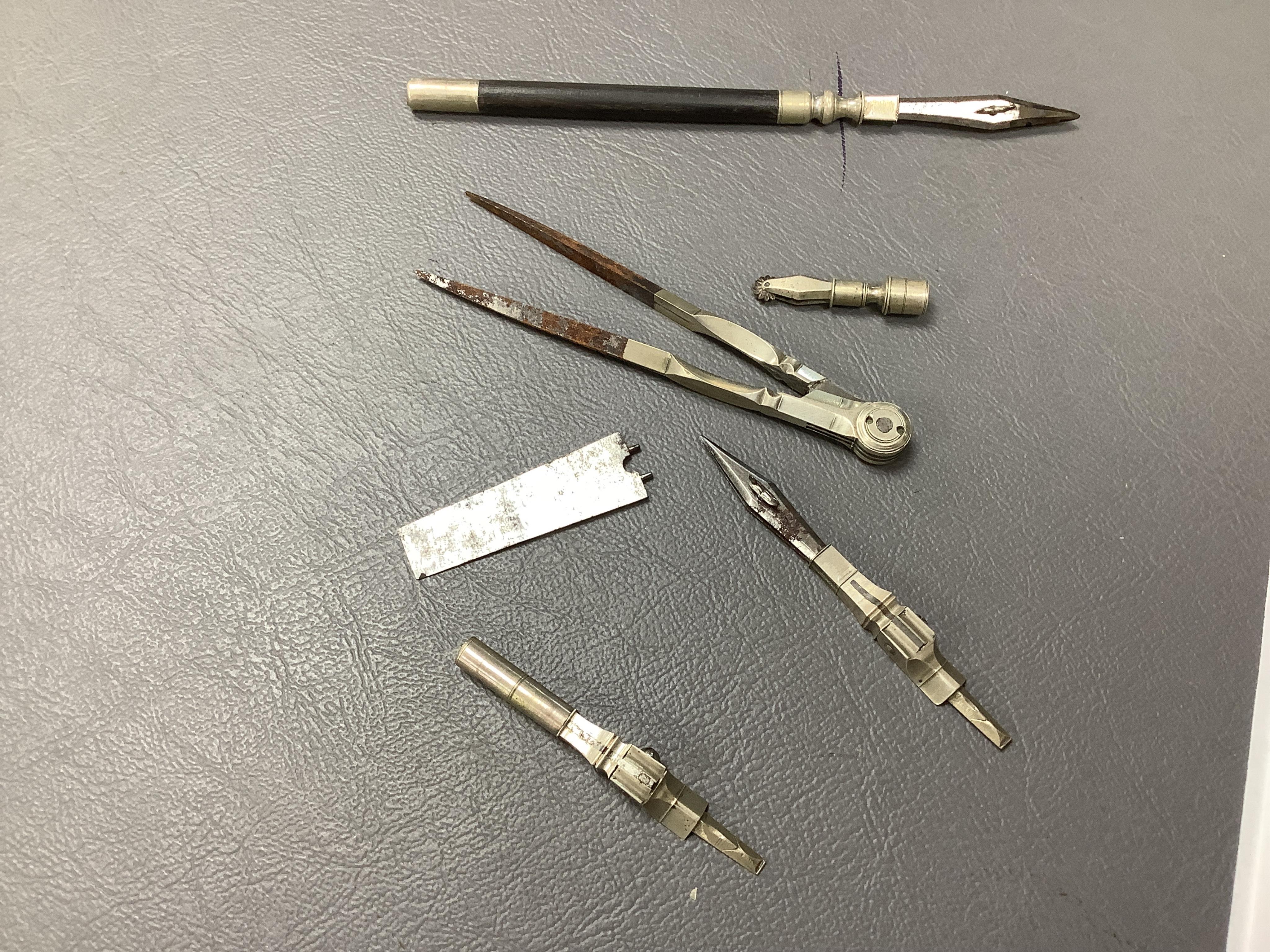 An early to mid 19th century pocket draughtsman's set containing steel drawing implements, (several items missing/broken).